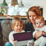 Mother and kids researching trusted and approved tradesmen